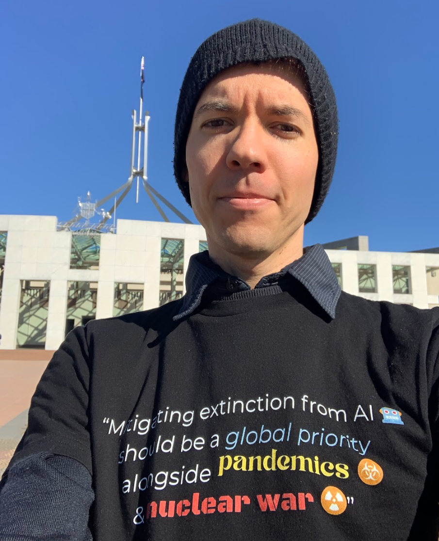 Volunteer in front of parliament house, Canberra.